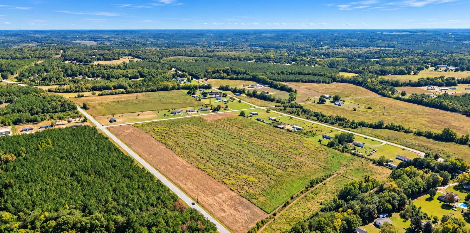 Own 5 Acres of South Carolina Peace and Possibility in Wallace. Enjoy level, open pasture with paved road frontage and public water available.