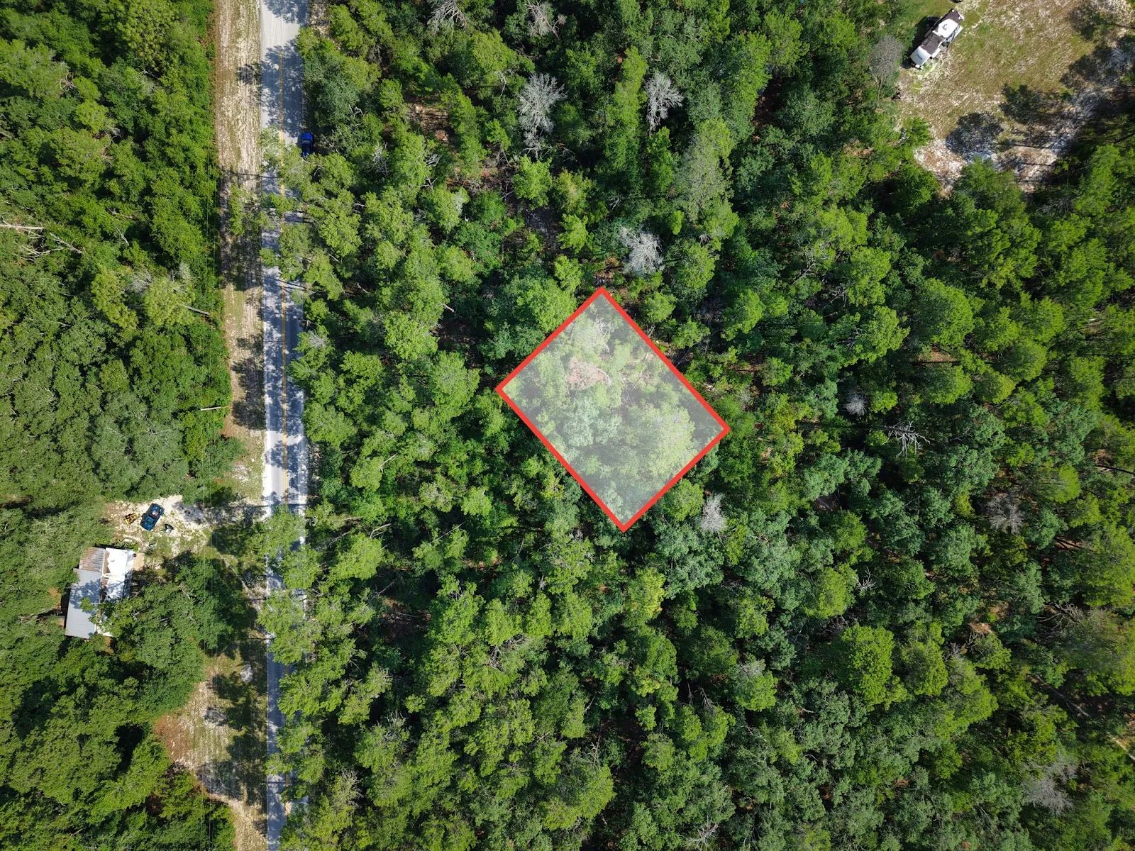 0.21 Acre Treed Lot Just Off the Pavement, yes with Road Access
