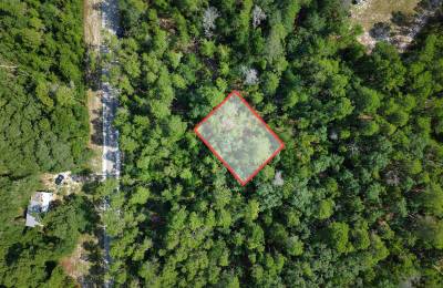 0.21 Acre Treed Lot Just Off the Pavement, yes with Road Access